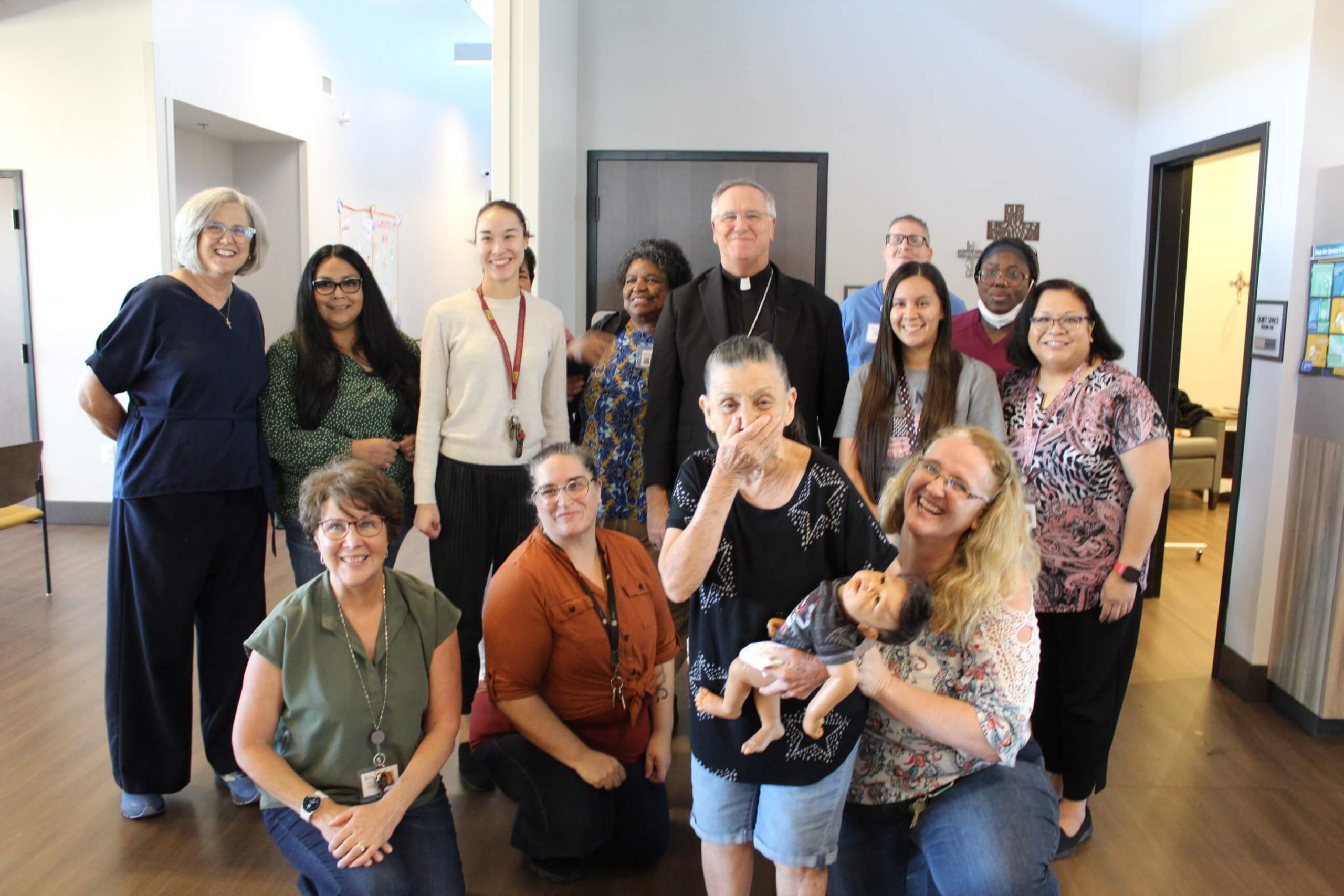 A group of staff posing for a group photo