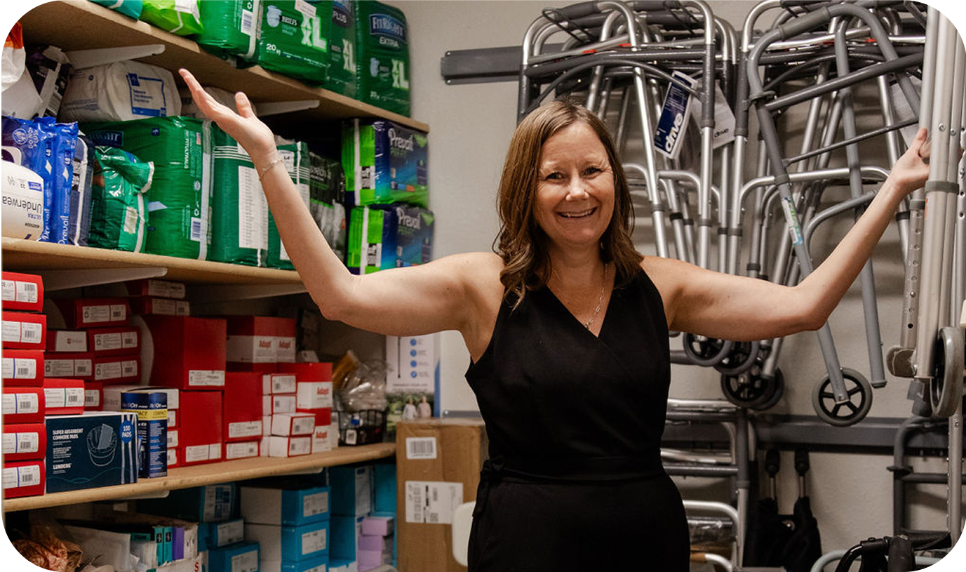 A staff member standing in a medical supply closet