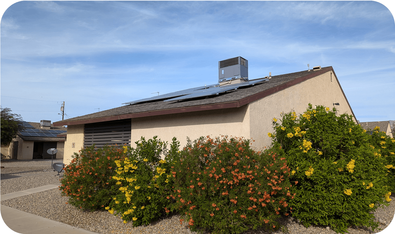 exterior of a house surrounded by flowers in a apartment center