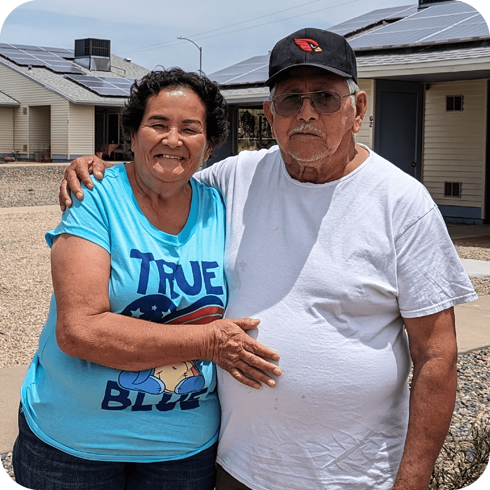 A senior couple posing together