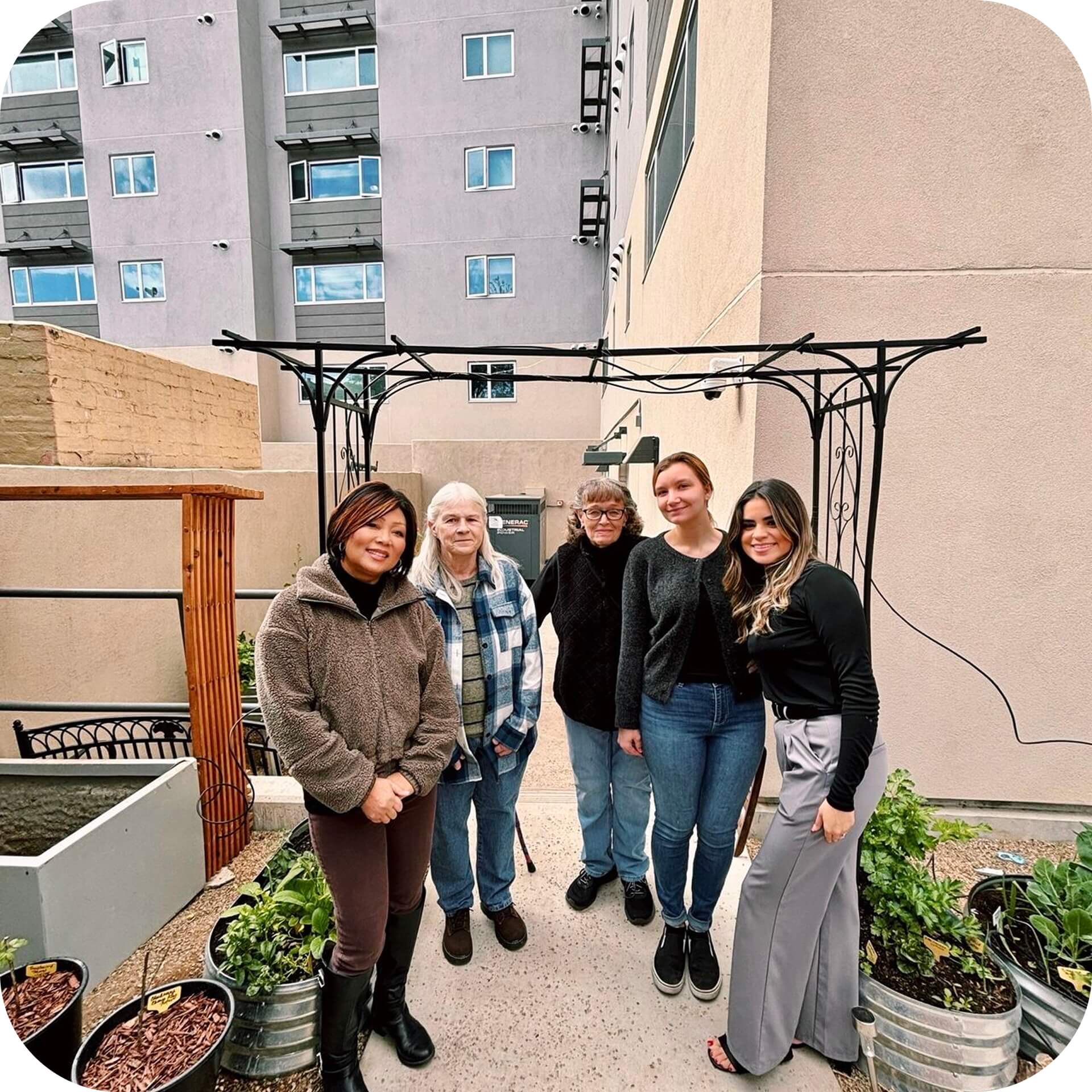 A group of volunteers helping in an urban garden