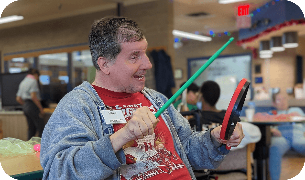 A man learning to playing some instruments