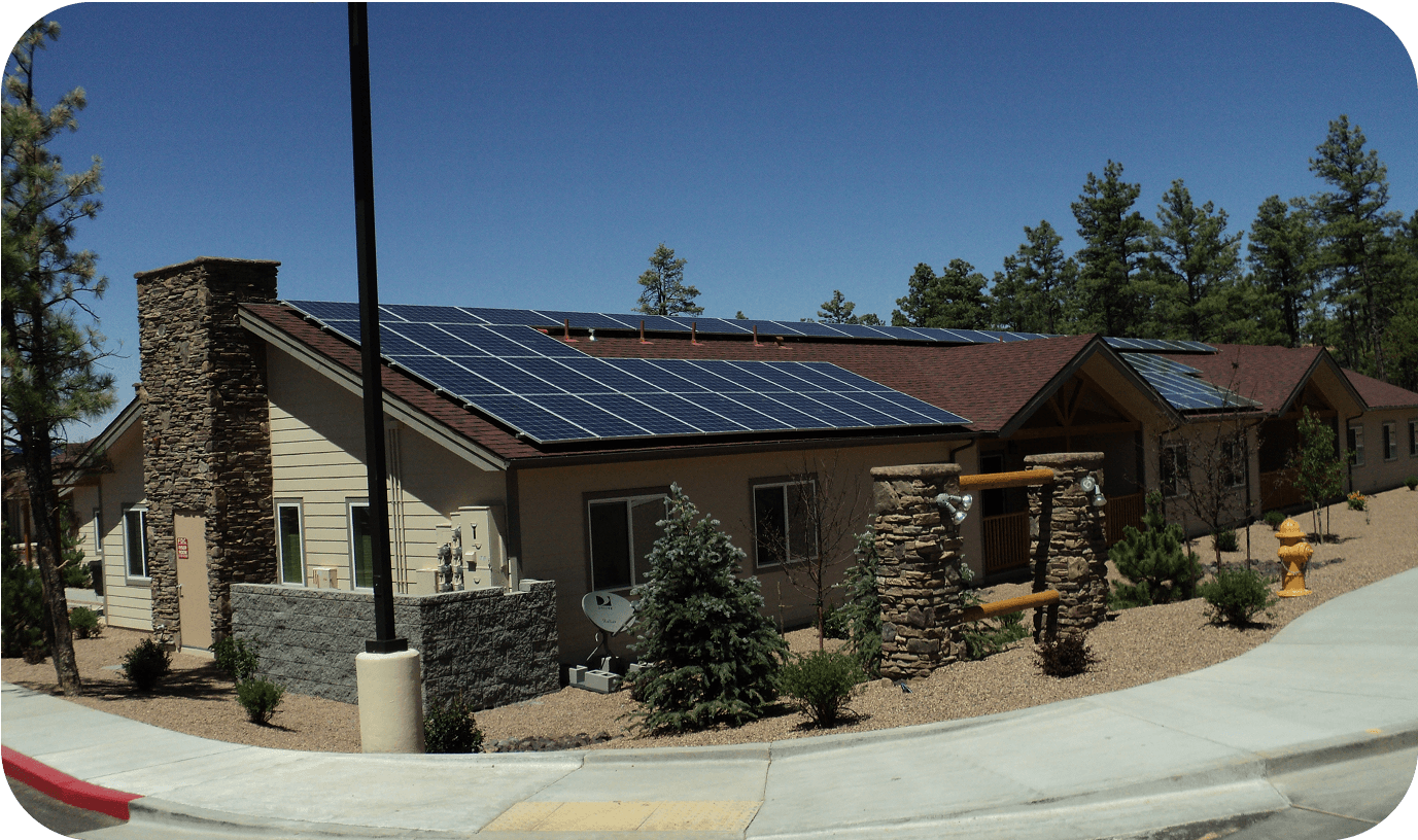 Exterior of a family housing building with solar panels on the roof